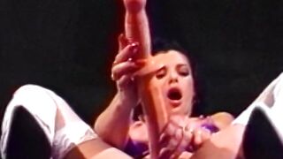 Gorgeous lesbian strips down and impales her pussy and ass