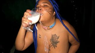 Drinking milk and playing with her ass